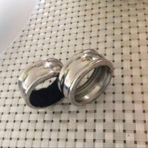 2 Silvertone Napkin rings